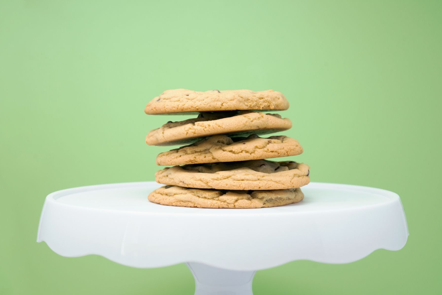 A stack of cookies on a green background